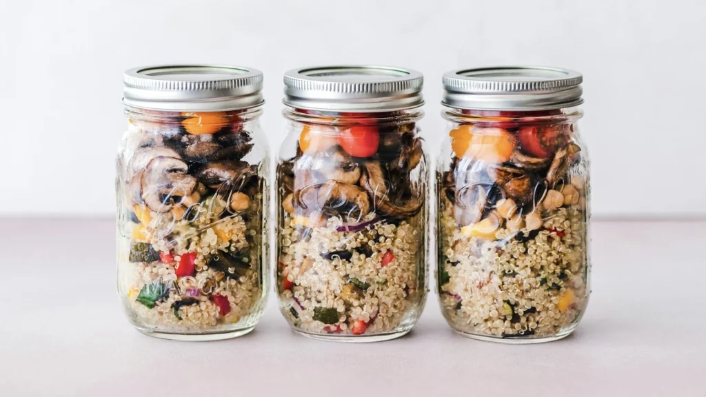 This image is a visual representation of a good high protein breakfast meal prep. It has protein rich vegetables packed in jars.