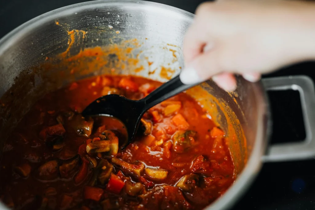 This image shows a vegetarian stew pot which represents a vegetarian meal prep batch cooking